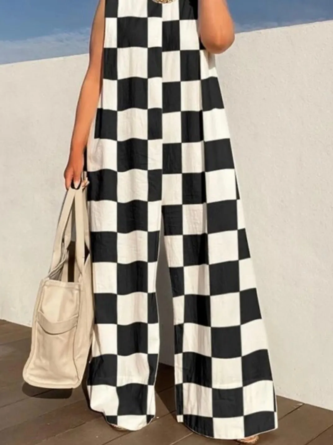 Checkerboard black and white jumper overall